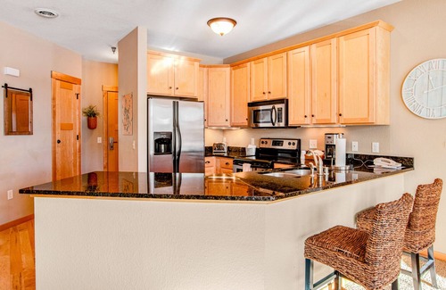 Three Lakes Condo | Lakefront condo with fireplace, hot tubs, heated pool, tennis, gym, firepit, AC