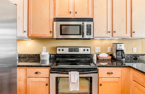 Three Lakes Condo | Lakefront condo with fireplace, hot tubs, heated pool, tennis, gym, firepit, AC