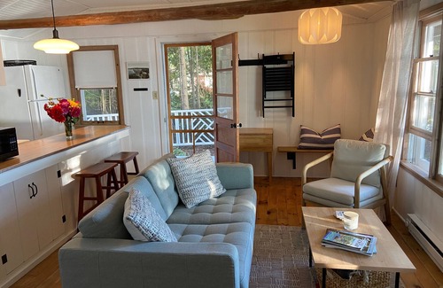 Baileys Harbor Cottage | Lakefront Cottage Retreat w/Private Dock, Paddle Boards, Fire Pit, Sunset Views