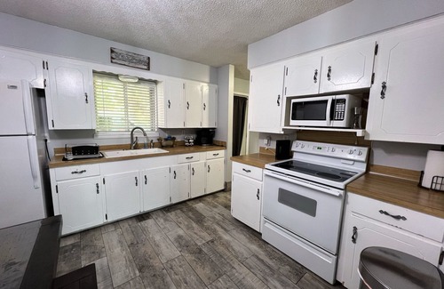 Rogers Cottage | Lakefront family friendly Chalet with fire pit and use of kayaks and canoe.