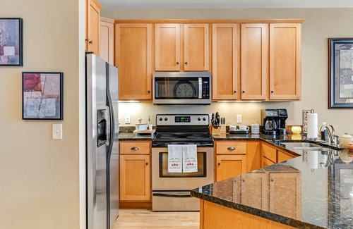 Three Lakes Condo | Lakefront ground-floor condo with balcony, fireplace, W/D, pool & hot tubs