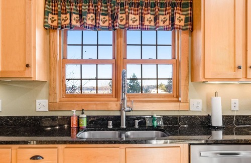 Three Lakes Condo | Lakefront, ground-floor condo with fireplace, patio, private grill & firepit