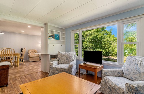 Frankfort Cottage | Lakefront historic cottage with firepit, basketball court access, & kayaks