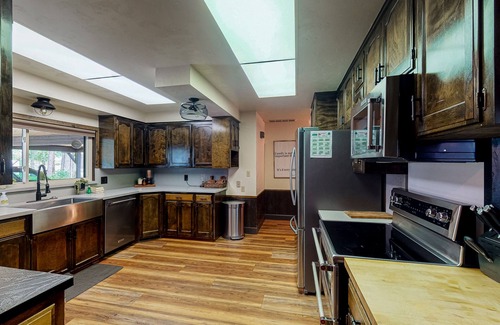 Bass Lake House | Lakefront home w/private boat dock, hot tub, gas grill, buoy, & wood fireplace