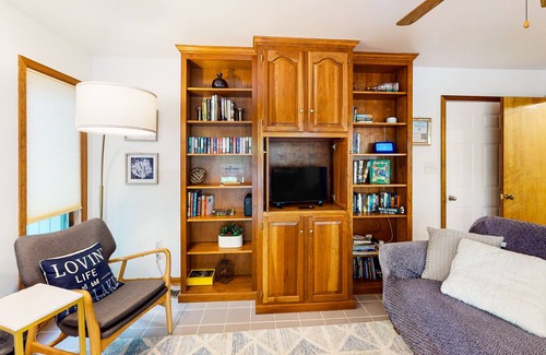 Lakeside Woods House | Lakefront home with hot tub, WiFi, dock, lake views, AC, & wood fireplace