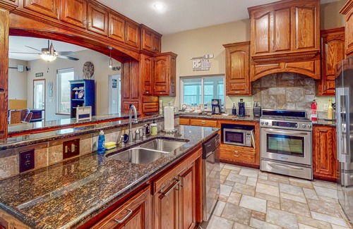 Rambo Riviera House | Lakefront home with hot tub, firepit, washer/dryer, kayaks, & hammocks