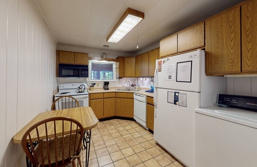 Greenville Junction House | Lakefront Home with Private Dock, Pebble Beach & Enclosed Porch - Dogs Welcome