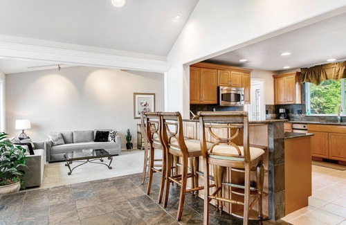Bonney Lake House | Lakefront house with built-in bar & grill, fireplace, beach, & dock
