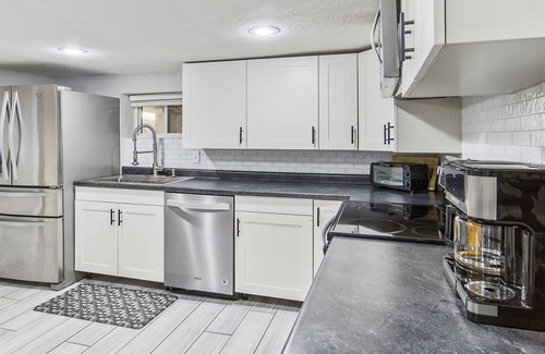 Barnett House | Lakefront retreat with a private dock, furnished patio & washer/dryer