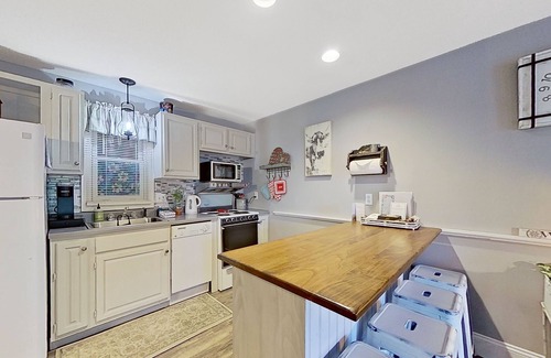 Gilford Condo | Lakeside condo with beach/water access, pool & sports courts