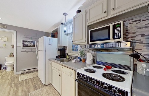 Gilford Condo | Lakeside condo with beach/water access, pool & sports courts