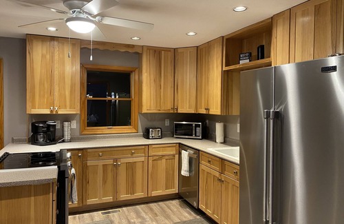 Logan Cabin | Lakeside Hideaway a spacious lodge with a lake view close to local attractions.