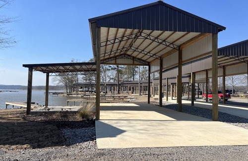 Lincoln House | Lakeside Luxury: Covered RV Site with Upgraded Patio and Private Pier