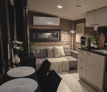 Kolari Ski Chalet | Lapland Riverside Cabin 7 PUOLUKKA, Ylläs, Tiny Home with Sauna, Fireplace, Terrace, BBQ, Wifi, Ski, Fishing, Pets OK