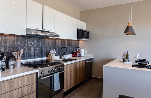 El Caloso Condo | Large Corner Balcony | Bar, Gym, in Romantic Zone