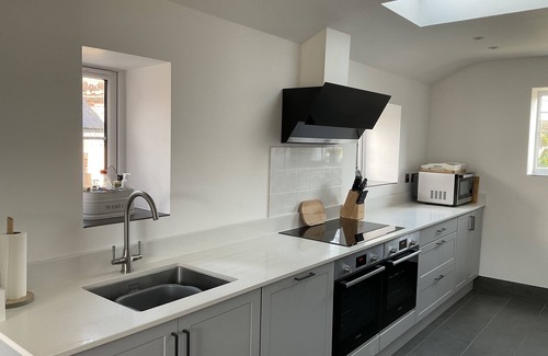 Bacton House | Large family house with private indoor heated pool in walking distance to beach.