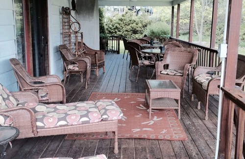 Dundee House | Large Lakefront Reunion And Retreat Home With a large lawn and wrap around porch
