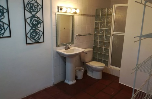 Playa Coronado Bed & Breakfast | Las Olas room - King size bed with private bathroom by the beach.
