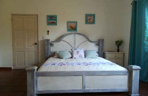 Playa Coronado Bed & Breakfast | Las Olas room - King size bed with private bathroom by the beach.