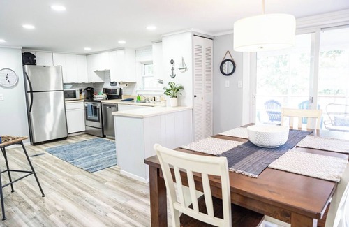 Fair Play House | Light & Airy Lakefront Home with Flat Yard, Private Dock, Deck & Screened Porch