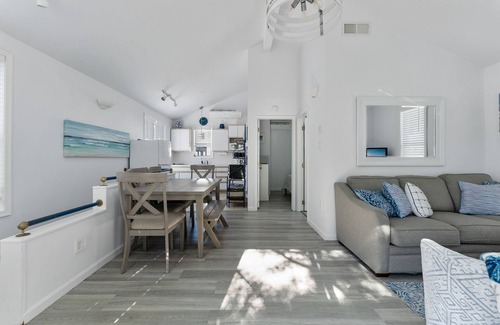 Townsend's Inlet Cottage | Light filled carriage house with gorgeous wrap around deck, ready for a perfect vacation getaway.