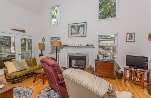 Demere Park House | Little Gingerbread Cabin Two Bedroom Two Bath Home with Rocking Chair Porch