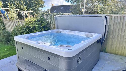 Seaton House | Littlefields - With hot tub, garden, private parking and short walk to beach