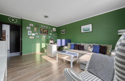 Krzyki Apartment | Lively Green Apartment in Wrocław with Balcony and Desk by Noclegi Renters