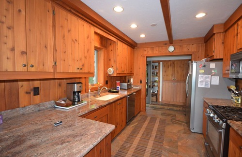 Suttons Bay House | Lodge-style home in Suttons Bay. Main house & caboose. Central A/C. Pet ok.
