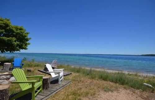 Suttons Bay House | Lodge-style home in Suttons Bay. Main house & caboose. Central A/C. Pet ok.