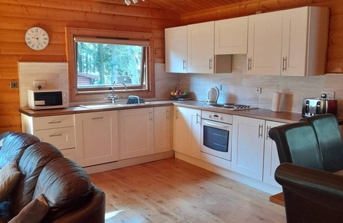 Kenwick Cabin | Log cabin with decked veranda, nestled in Kenwick Park, Louth