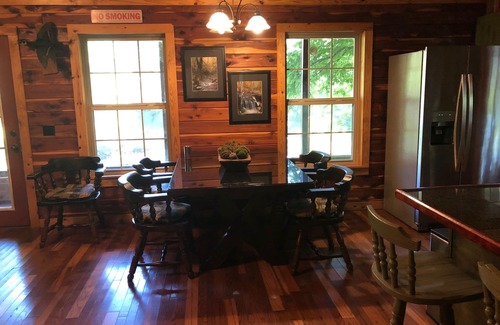 Heber Springs Cottage | Log Cottage on the Little Red River with hot tub.