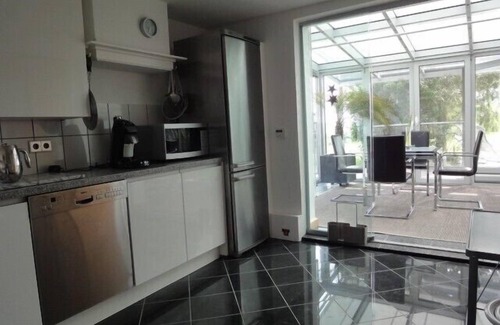 Breskens House | Lone-standing comfort house with a winter garden, 200m from the sea