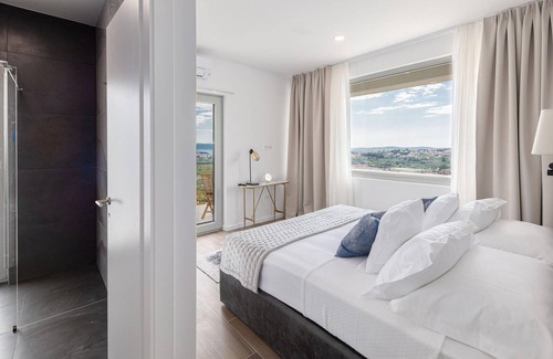 Zrnovnica House | Look forward to a modern vacation home with a well-kept garden, a large terrace and high-quality fur