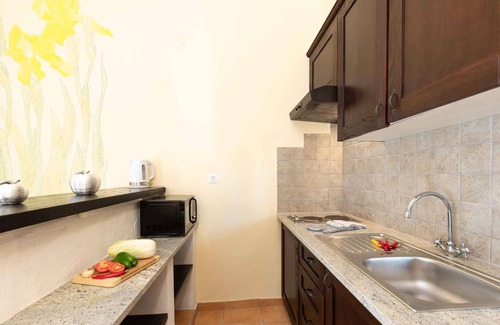 Brzac Apartment | Lotus Resort vacation apartment with swimming pools and garden as well as children's playground and parking lot surrounded by greenery and forest