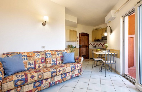 Canneddi Apartment | Lovely apartment for 4 people with A/C, pool, WIFI, TV, terrace, pets allowed and parking