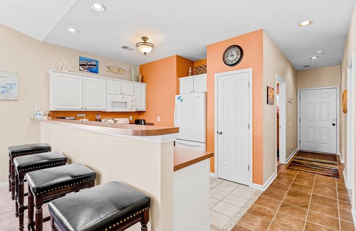 Sunset Beach Condo | Lovely condo with water view, balcony, full kitchen & W/D - dog-friendly