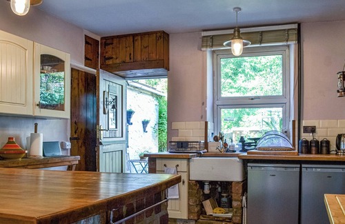 Margam Cottage | Lovely cottage with a large garden and decked area overlooking the River Taff.