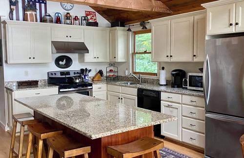 Raymond House | Lovely waterfront home on Panther Pond with private tennis/pickleball court!