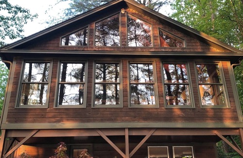 Raymond House | Lovely waterfront home on Panther Pond with private tennis/pickleball court!