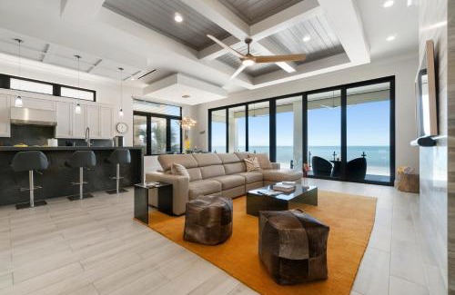 Mid Island House | Luxurious Beachfront Vacation Getaway, 4 Bedroom, 4 and half Bath w Heated Pool, Spa, Sleeps 12
