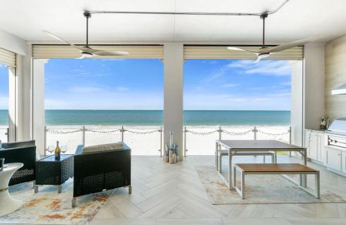 Mid Island House | Luxurious Beachfront Vacation Getaway, 4 Bedroom, 4 and half Bath w Heated Pool, Spa, Sleeps 12