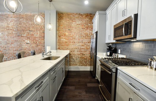 Central Business District Hotel | Luxurious Charm: Elegance with Exposed Brick Walls in New Orleans' CBD