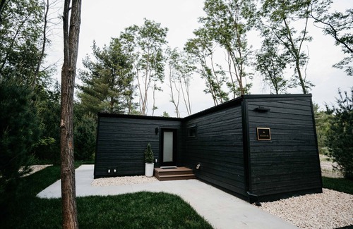 Pepin Cabin | Luxurious mirrored cabin nestled on the Woods & Co Weddings + Events property for the ultimate getaway
