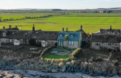 Boulmer House | Luxurious & modern on-the-beach family retreat