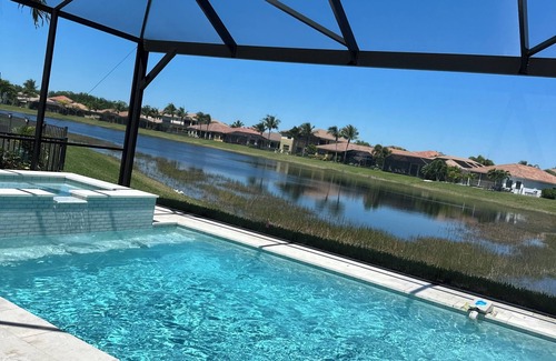 Naples House | LUXURIOUS OPEN CONCEPT WATERFRONT HOME. 3 BED 3 BATH. PRIVATE HEATED POOL & SPA.