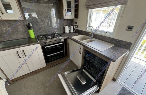 Porthcawl House | Luxury 2 bedroom family caravan, with decking and close to the beach.