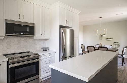 Hamilton Apartment | Luxury 2000 sq ft suite in Mini Mansion steps to Locke St. shops & restaurants.