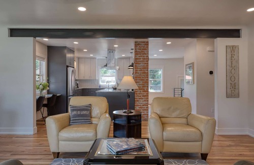 Collister House | Luxury at its Finest | Indulge in Gourmet Kitchen, Spacious Dining Area, Lovely Patio & Plush Beds