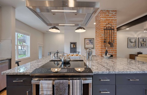 Collister House | Luxury at its Finest | Indulge in Gourmet Kitchen, Spacious Dining Area, Lovely Patio & Plush Beds